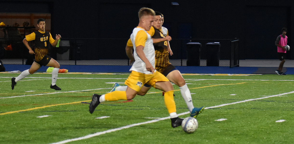 Mustangs drop overtime opener